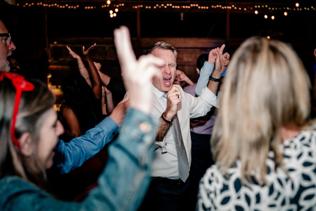 A guest dancing during a Murray Hill wedding reception