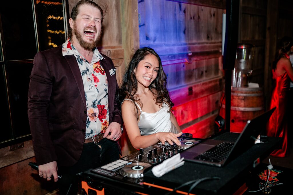 A bride working the DJ booth during her Murray Hill wedding reception
