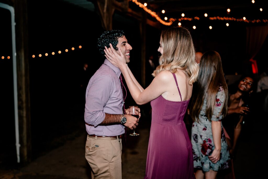 Wedding guests having fun together during a barn wedding reception