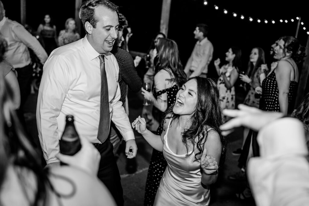 A bride and groom celebrating on the dance floor during their Loudoun County wedding