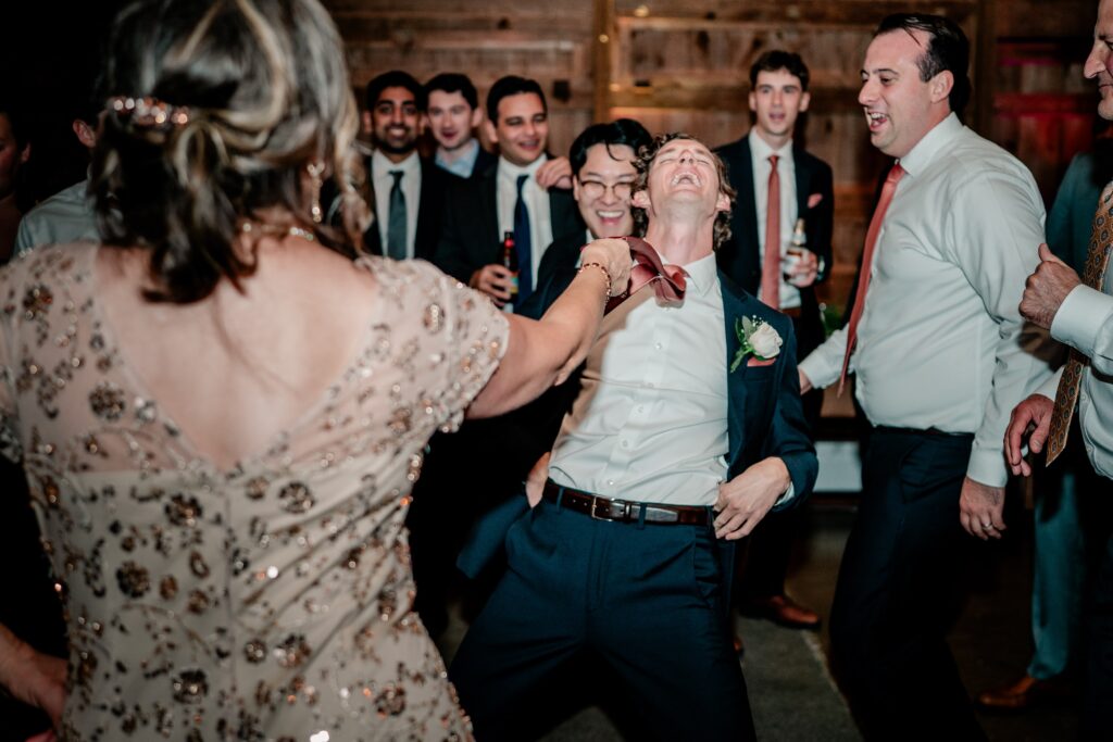 Wedding guests having fun together on the dance floor