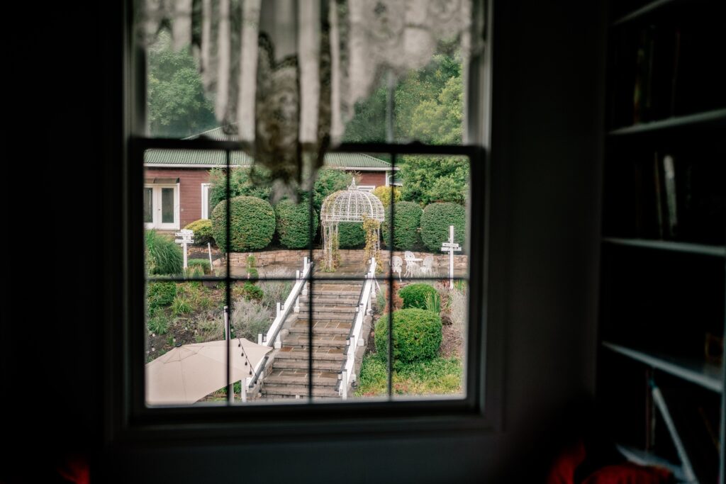 A view of a garden out the window of a Loudoun County wedding