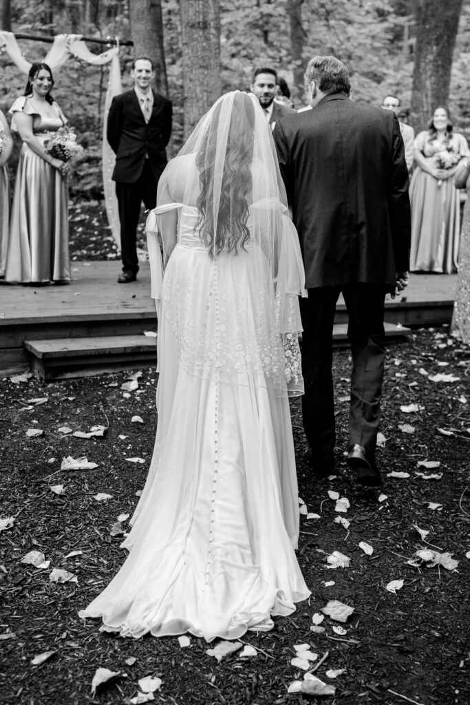 A bride processing toward her groom to start her Loudoun County wedding