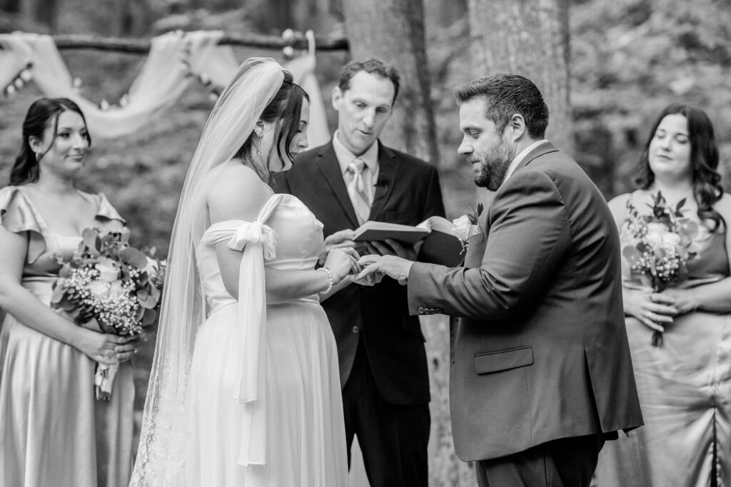 A bride and groom exchanging rings during their Loudoun County wedding