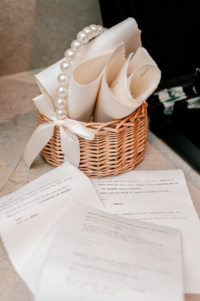 A pile of letters written to the bride and groom during their Stone Manor Boutique Inn wedding reception