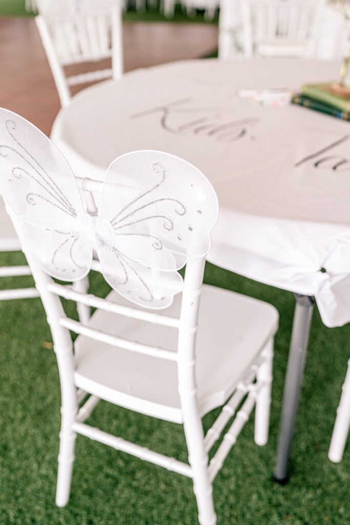 A Stone Manor Boutique Inn wedding featuring fairy wings on the reception chairs