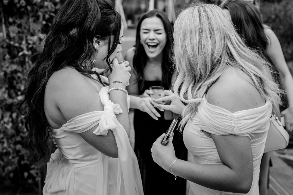 A bride's friends excitedly looking at her ring during her Loudoun County wedding