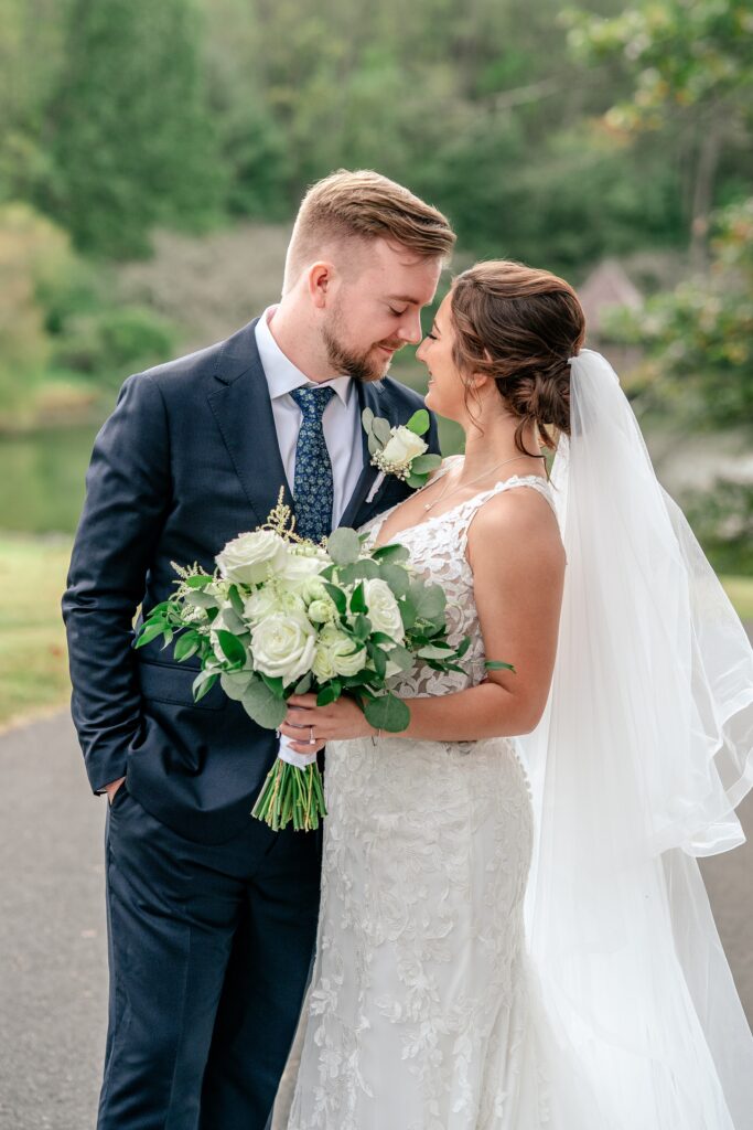 A bride and groom sharing a tender moment together before their Atrium at Meadowlark wedding