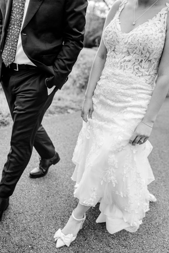 A stylish bride and groom walking together as photographed by their Northern VA wedding photographer