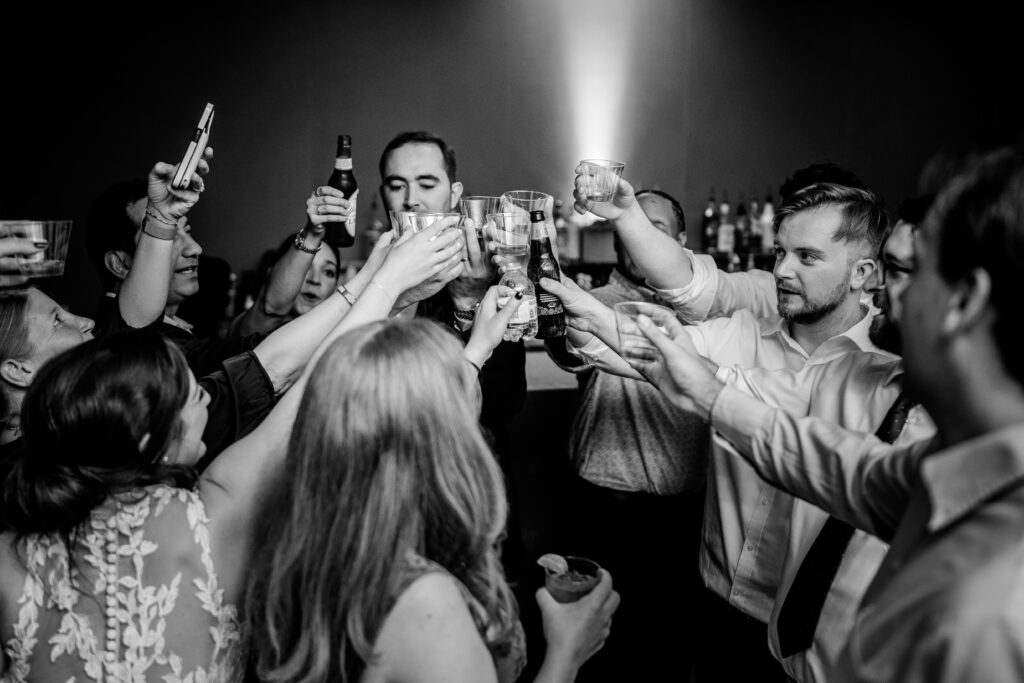 Friends raise their glasses for a toast