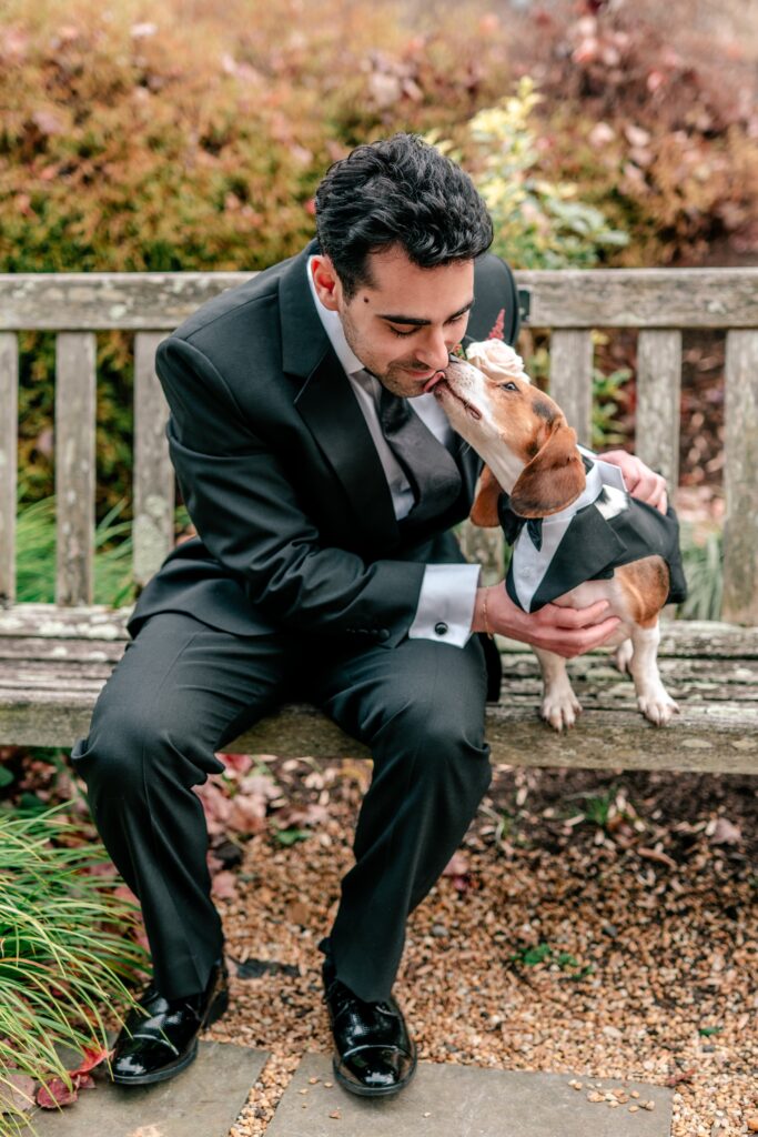A groom and his dog before his Atrium at Meadowlark indoor wedding
