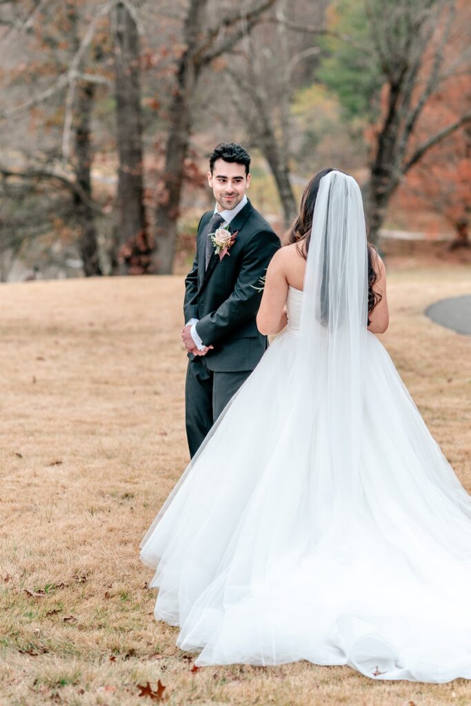 A groom sees his bride for the first time during their first look before their Meadowlark Botanical Gardens fall wedding