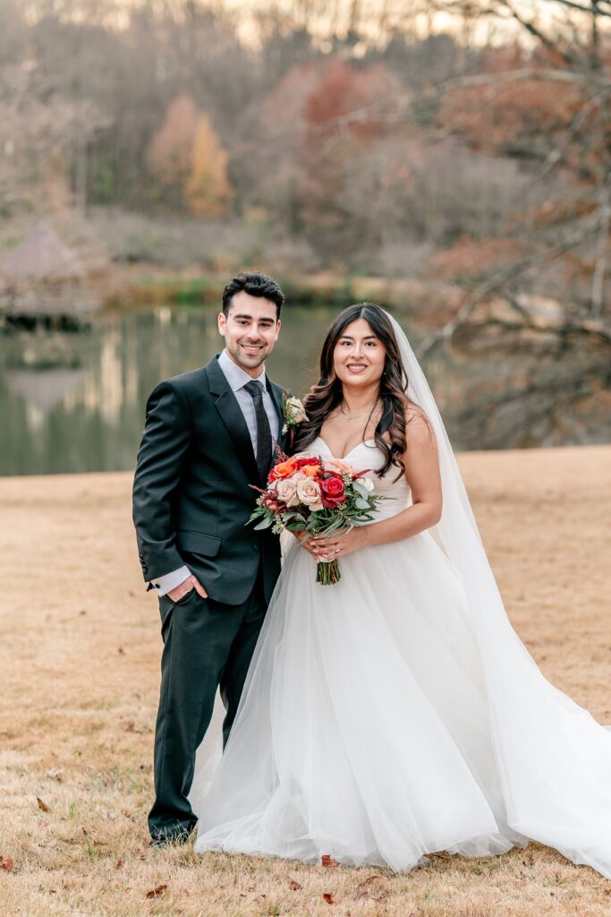 A bride and groom pose for a classic portrait on the day of their Meadowlark Botanical Gardens fall wedding