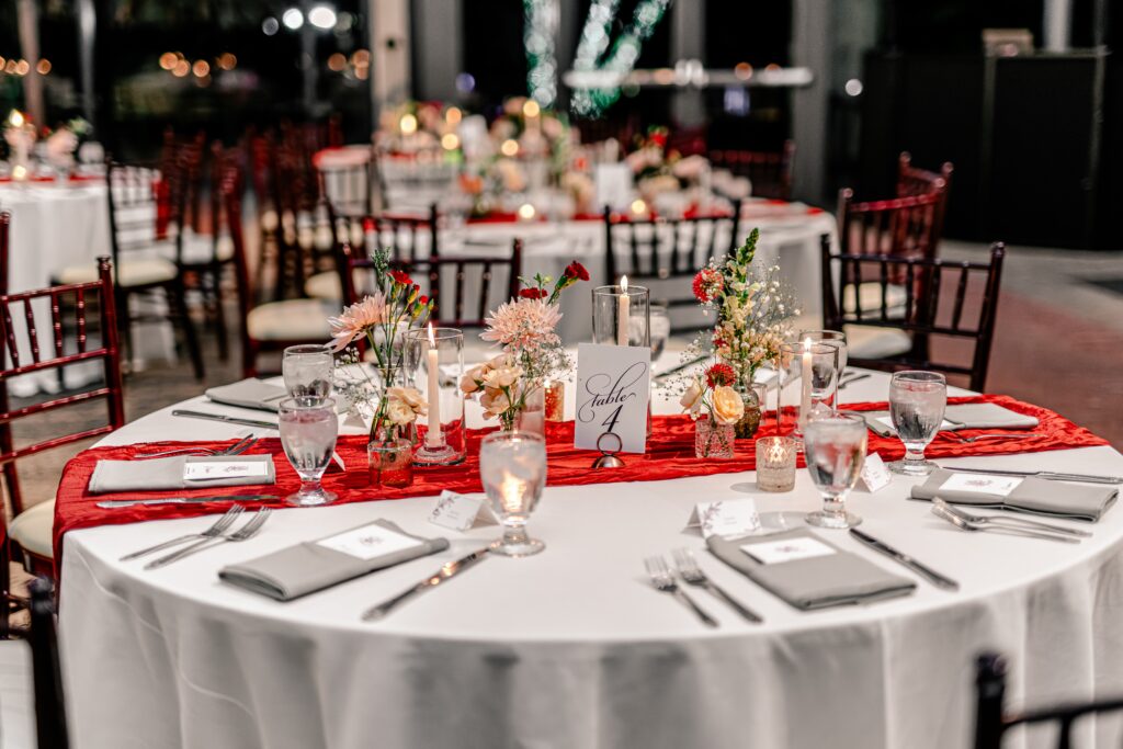 A close up of a table set for an Atrium at Meadowlark indoor wedding reception