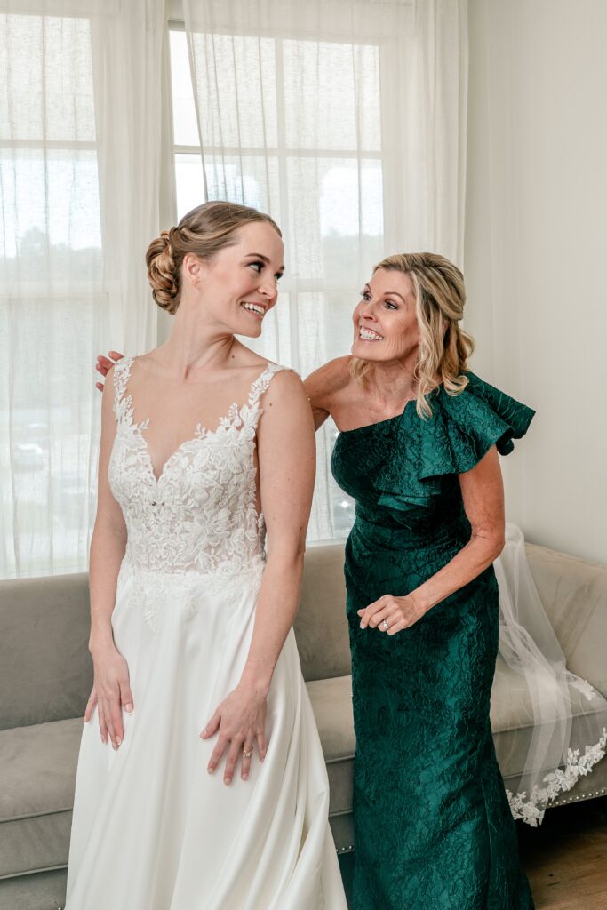 A bride and her mom getting ready together