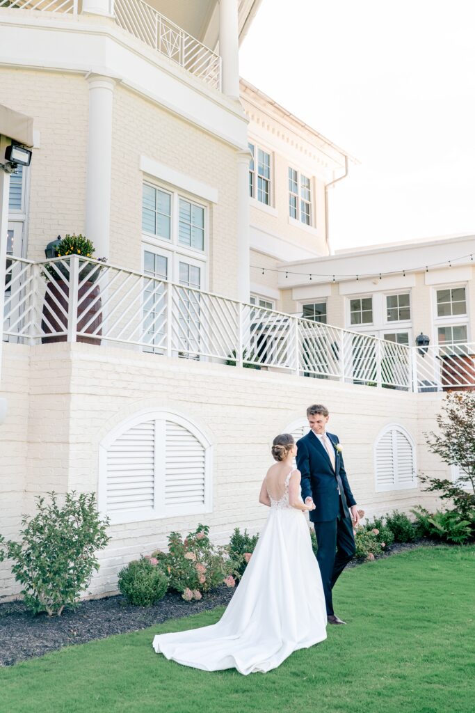 A groom sees his bride during their first look orchestrated by the Richmond wedding photographer