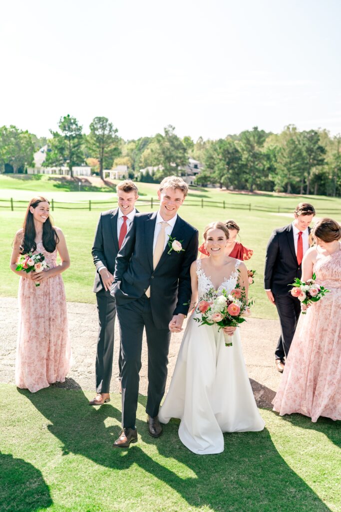 A wedding party laughing together before a The Estate at Independence wedding
