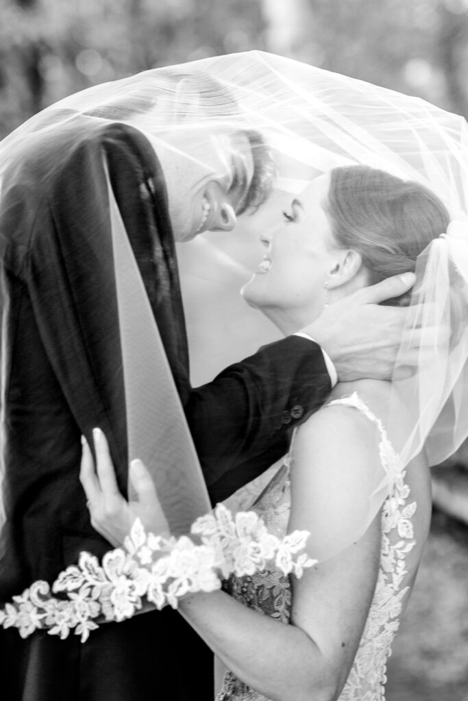 A tender portrait of the bride and groom by their Catholic wedding photographer