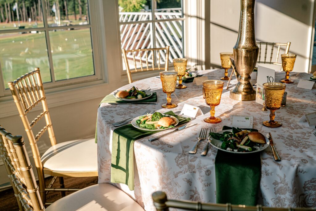A Catholic wedding photographer captured hard light on a reception table set for dinner
