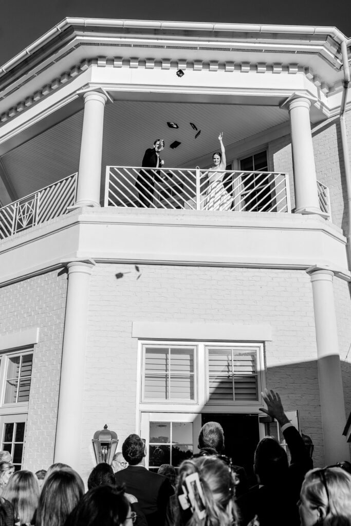 A bride and groom toss can coozies as wedding favors for their The Estate at Independence wedding