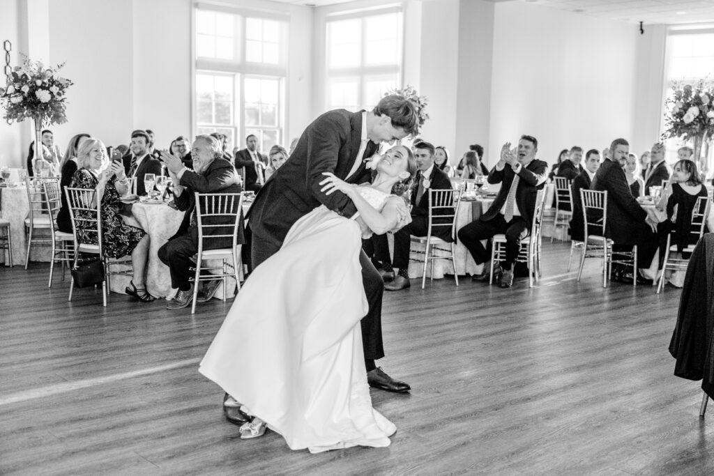 A Richmond wedding photographer captures a dip kiss between the bride and groom during their first dance