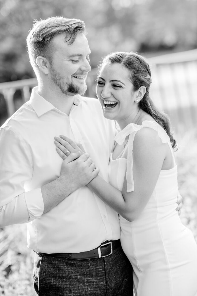 A couple laughing together during their Georgetown engagement photos