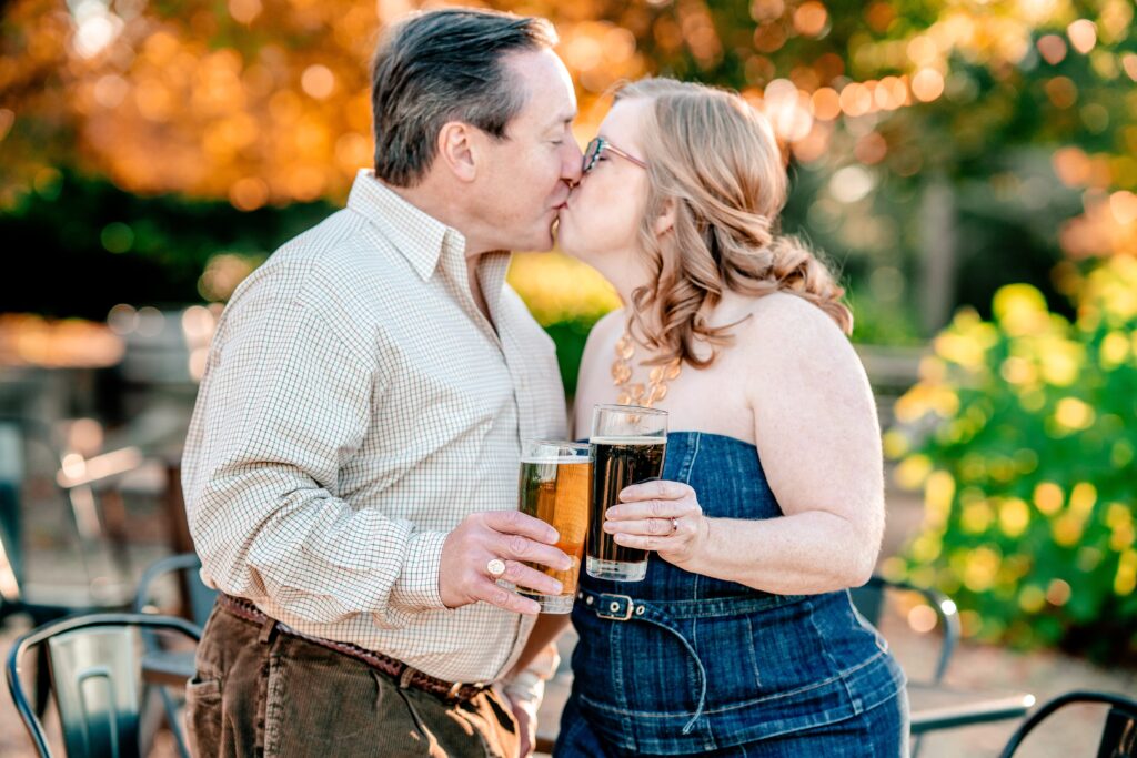 An engaged couple toasting to their engagement for their Catholic wedding photographer