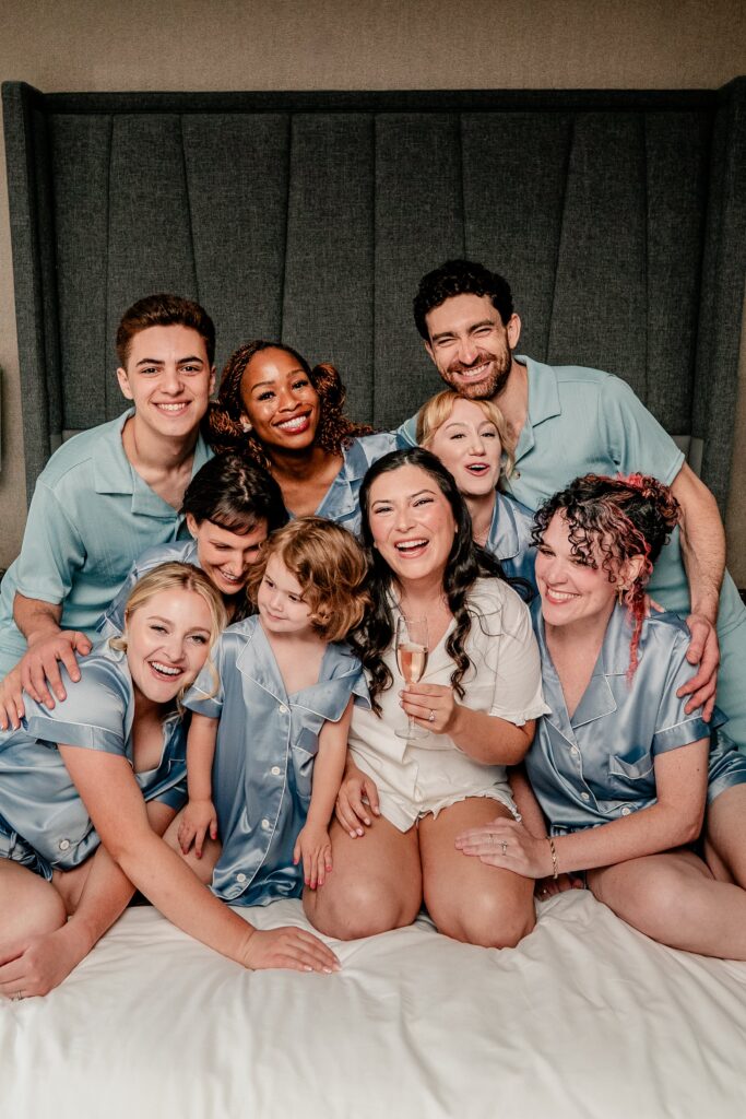 A wedding party laughing together for a Washington DC wedding photographer