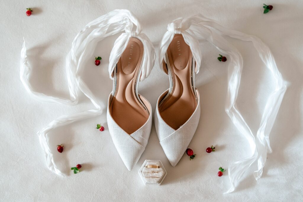 A pair of bridal shoes featuring long crepe ankle laces for a St Francis de Sales wedding in Purcellville