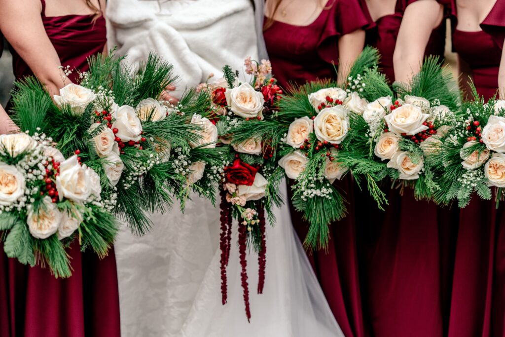 Christmas wedding bouquet inspiration with a cascading bridal bouquet and evergreen greenery