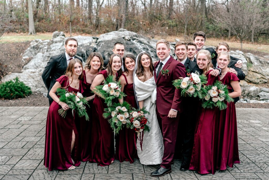 A bridal party gathering together during a Christmas wedding