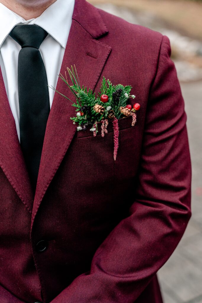 A pocket boutonniere for a Christmas wedding