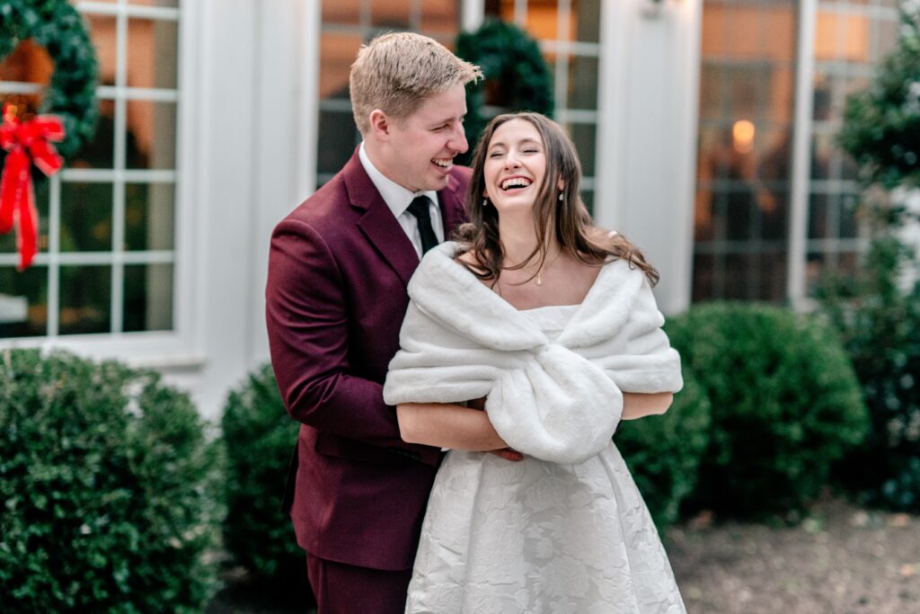 A bride and groom laughing together