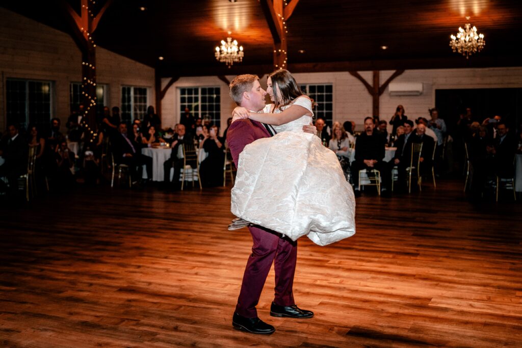 A groom holding his bride on the dance floor