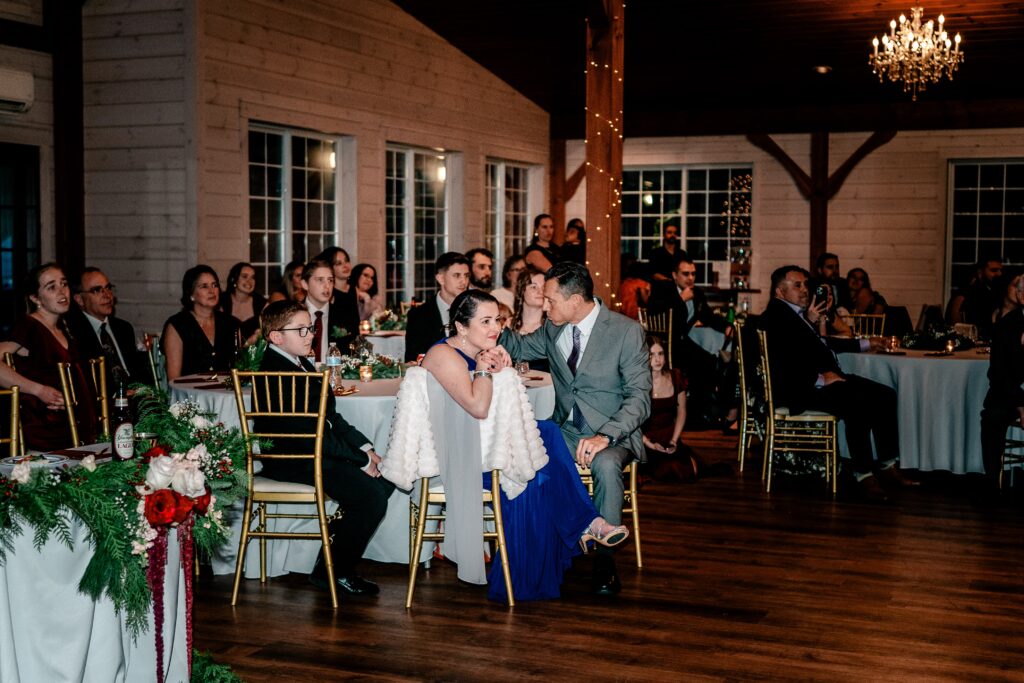 The mother of the bride watching the first dance in a candid photo
