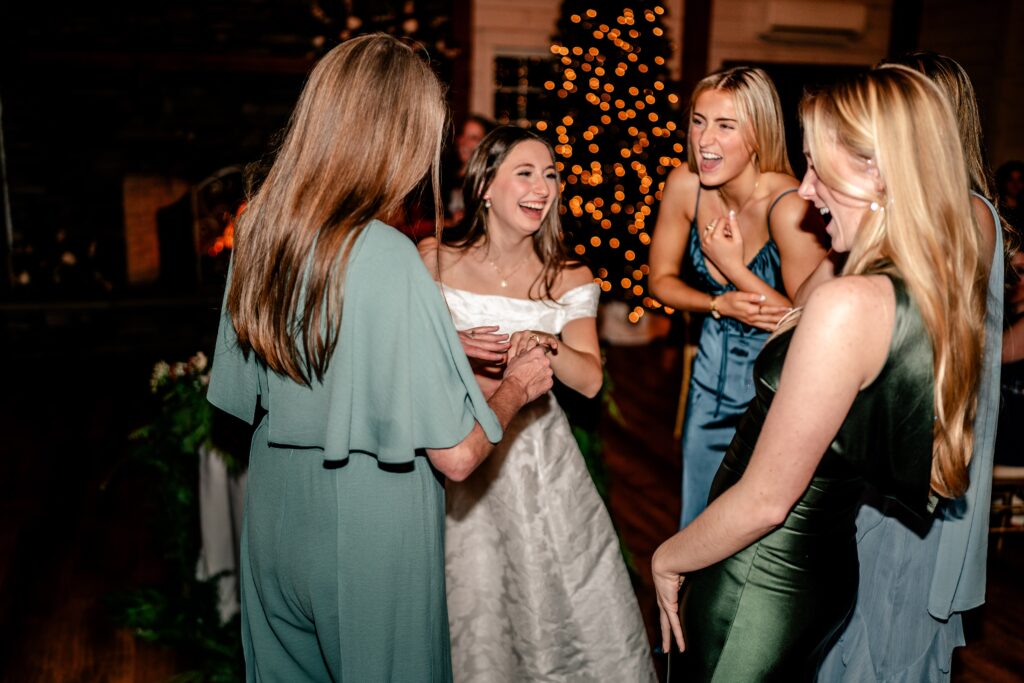 A Historic Rosemont wedding reception with the bride laughing with her friends