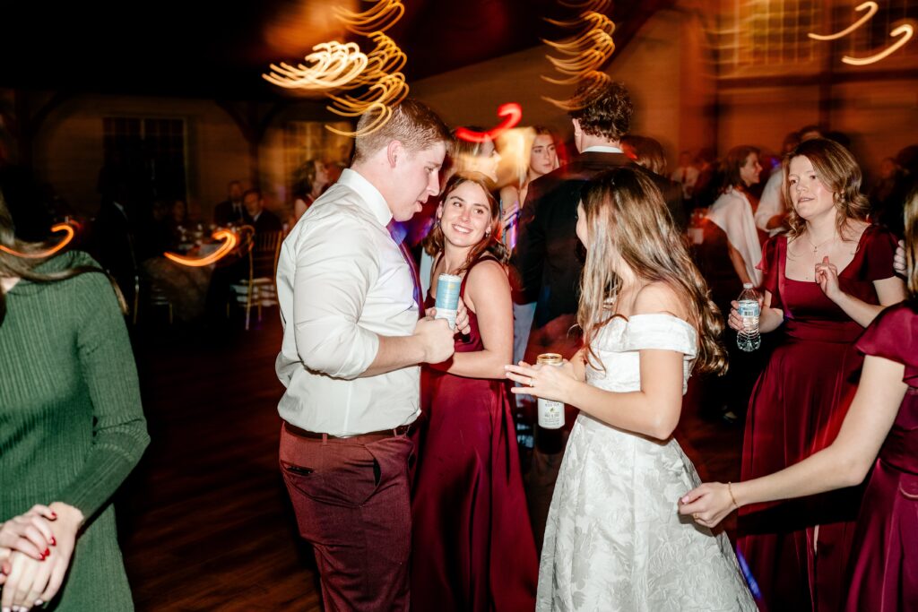 A Historic Rosemont wedding reception dance floor with the bride and groom drinking High Noons