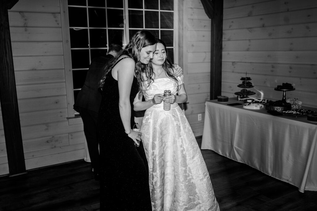 A tender moment between a bride and her friend