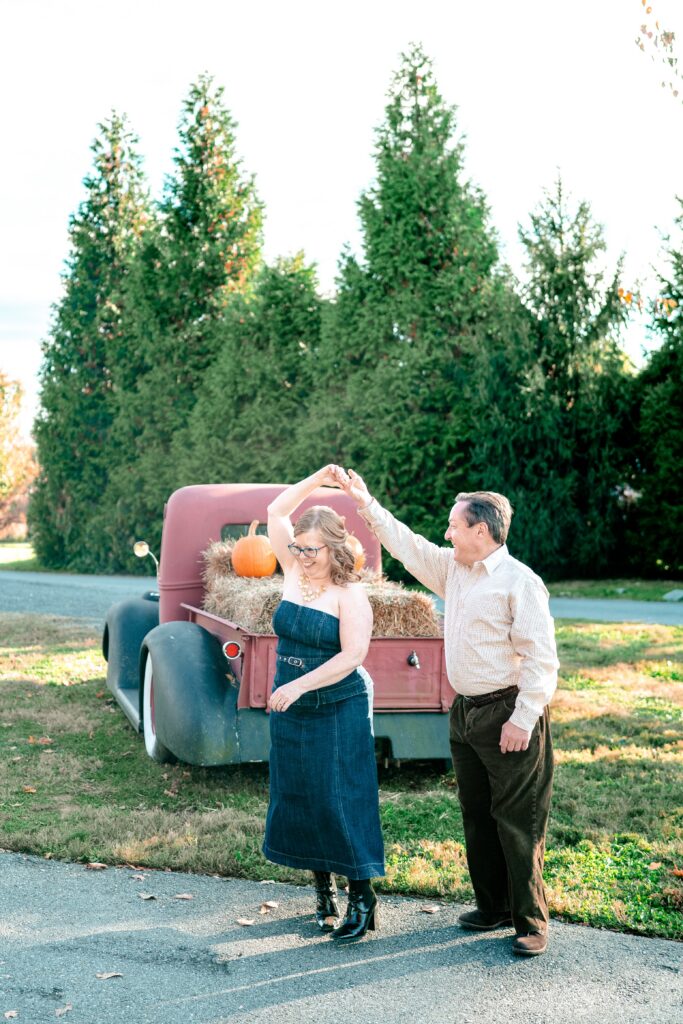 A couple dancing together during engagement photos at Waredeca Brewing Company
