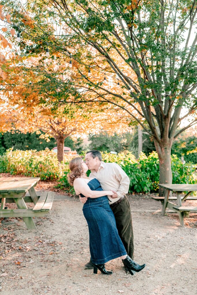 A romantic dip kiss for a couple posing for their Catholic wedding photographer