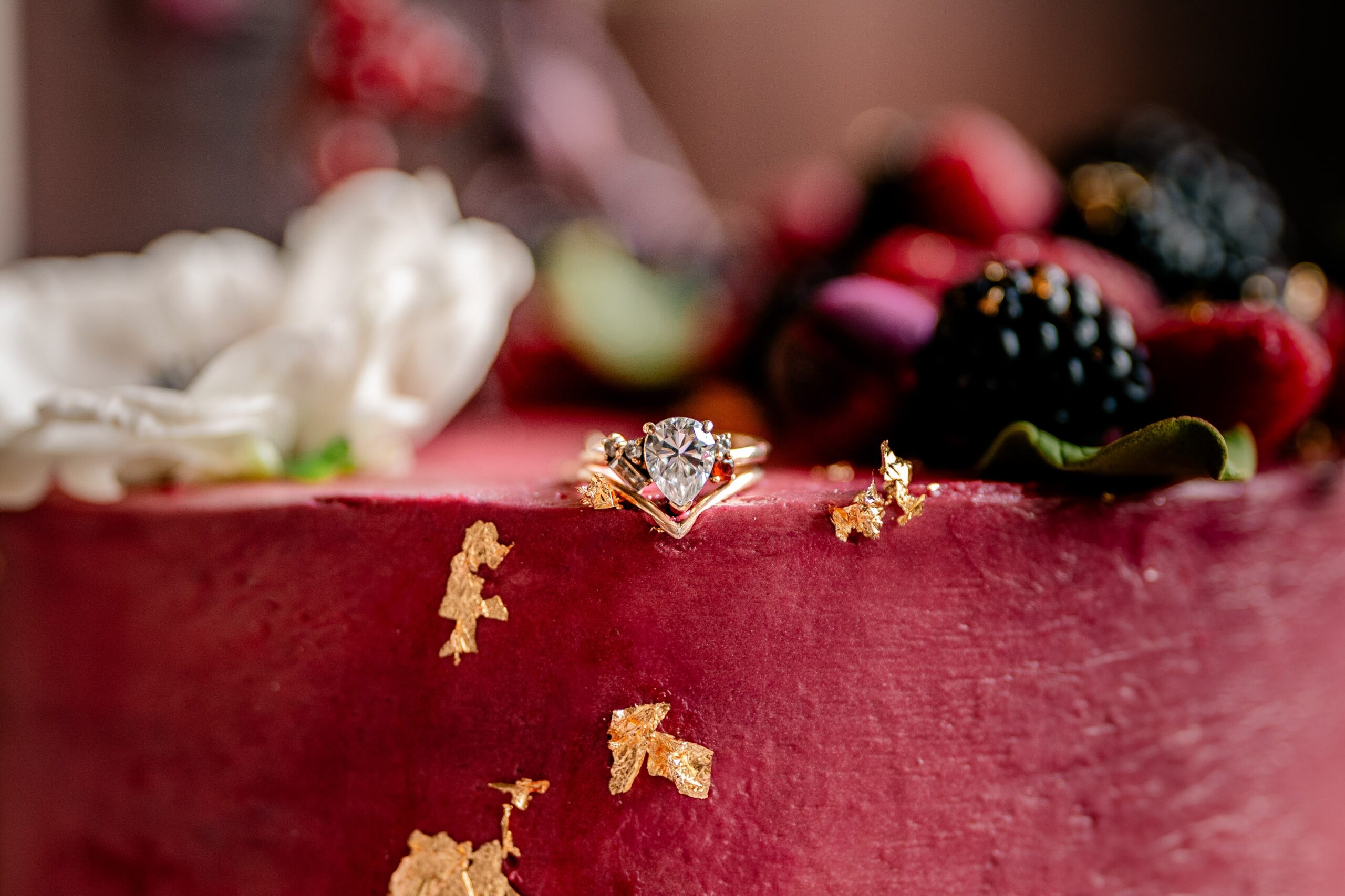 Renaissance wedding photos featuring berry details and gold accents