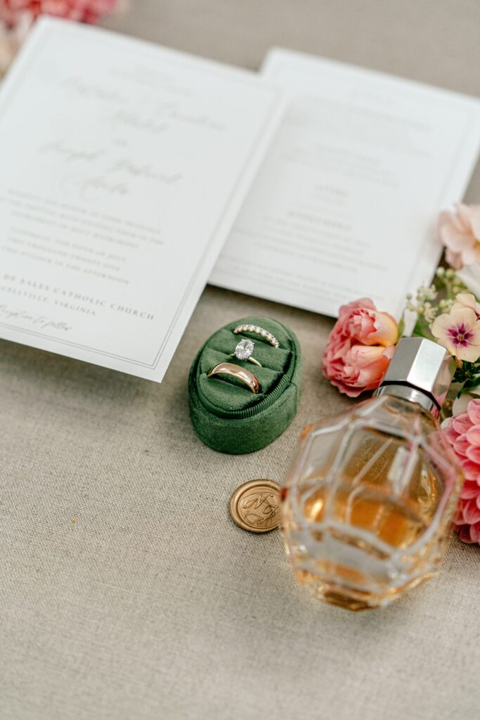 A ring box with a set of wedding rings and other pretty details for a Shadow Creek wedding