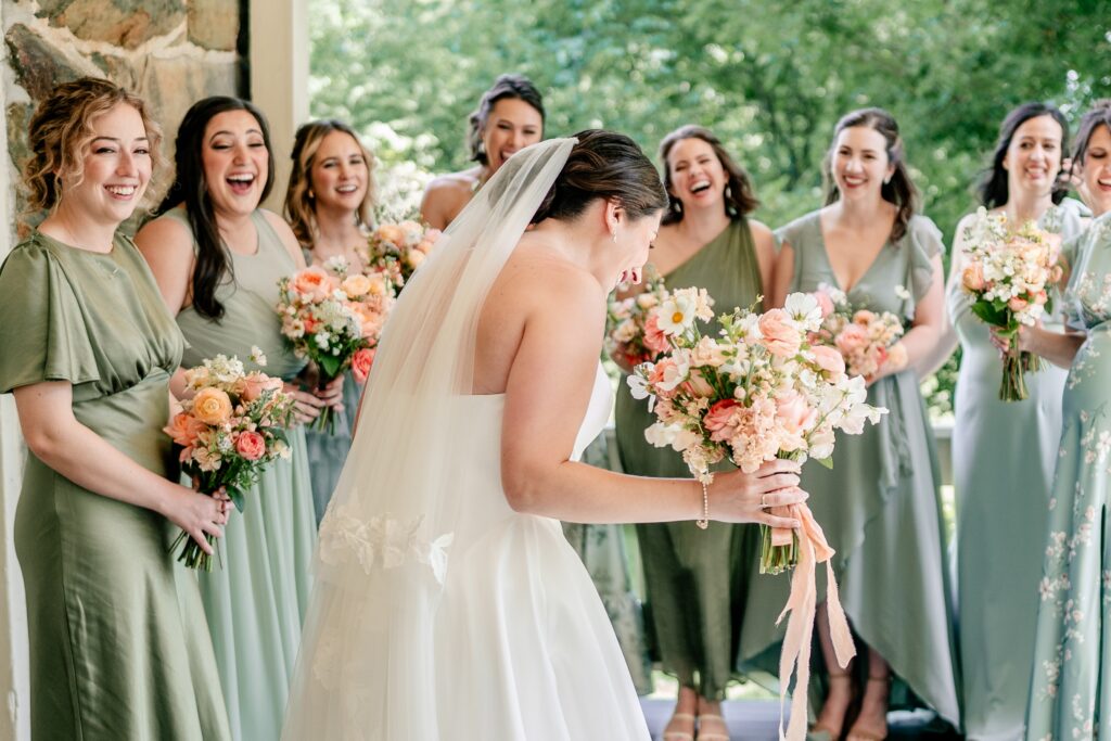 A Shadow Creek wedding featuring bridesmaids laughing during a special first look