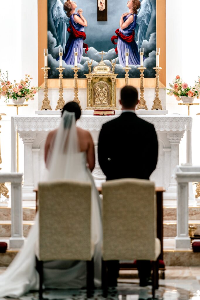 A bride and groom standing before the altar during their Loudoun County wedding