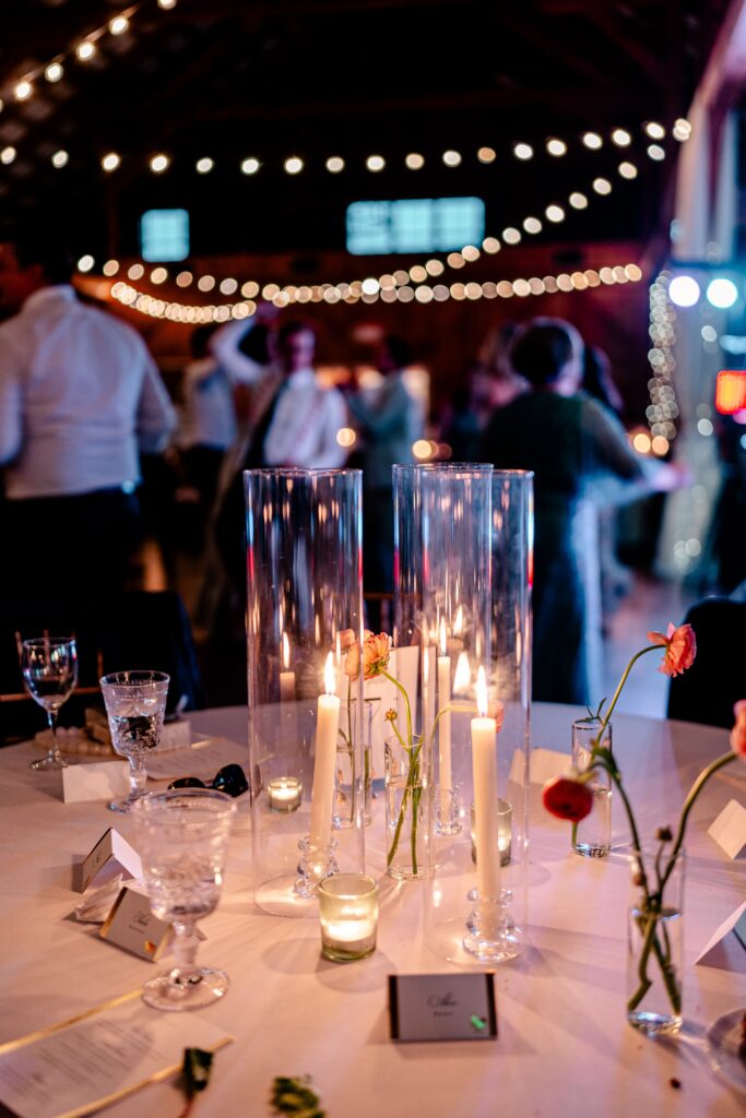 Glowing candlelight at a barn wedding reception in Loudoun County