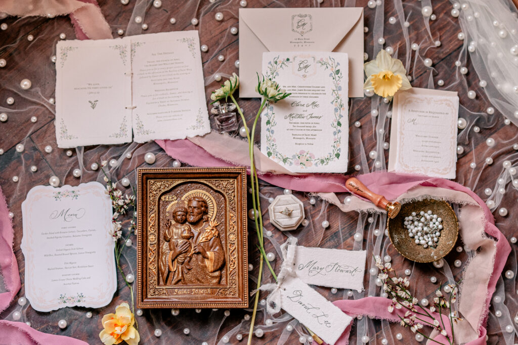 Romantic wedding details featuring wooden accents resting on a pearl veil for a tea party wedding