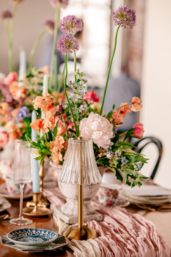 A lush and colorful floral centerpiece for a tea party wedding