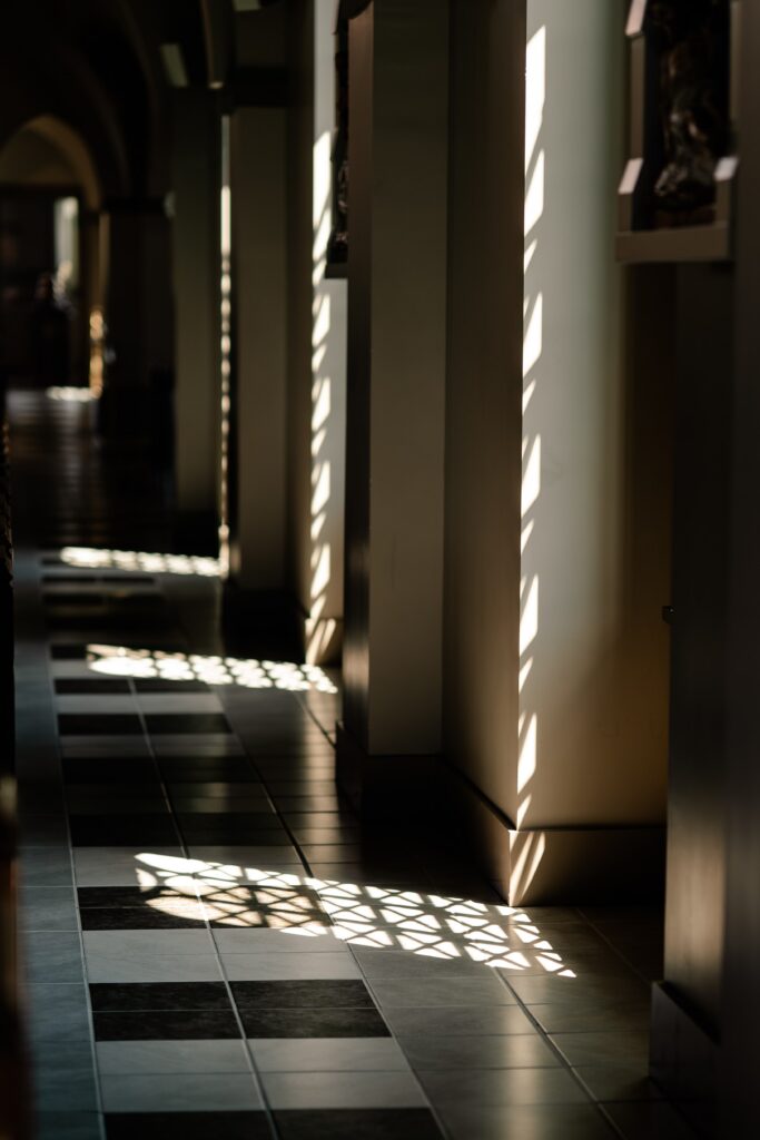 Light coming through the windows at a wedding at Corpus Christi Catholic Church in Aldie, VA
