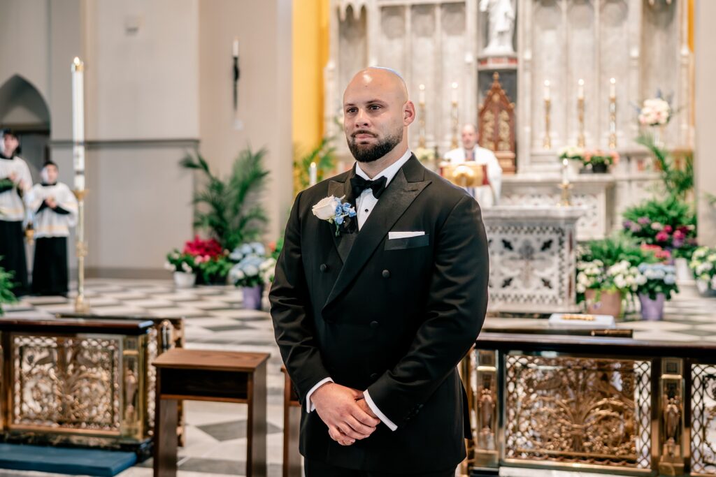 The beginning of a Loudoun County wedding as the groom watches his bride walk down the aisle