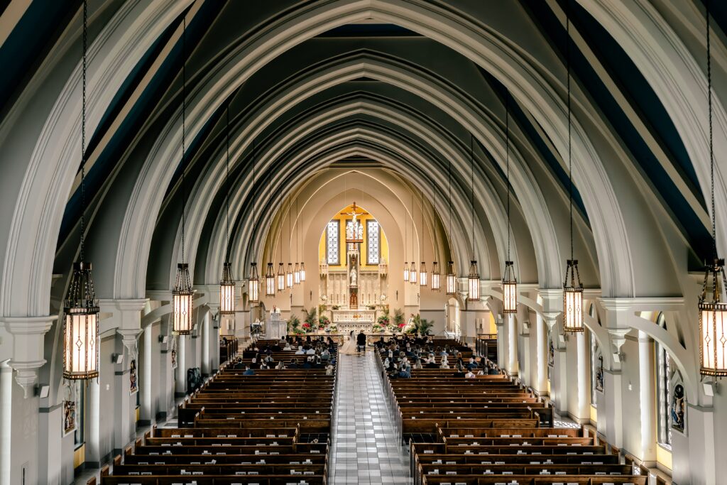 The view from the choir loft of a wedding at Corpus Christi Catholic Church in Aldie, VA